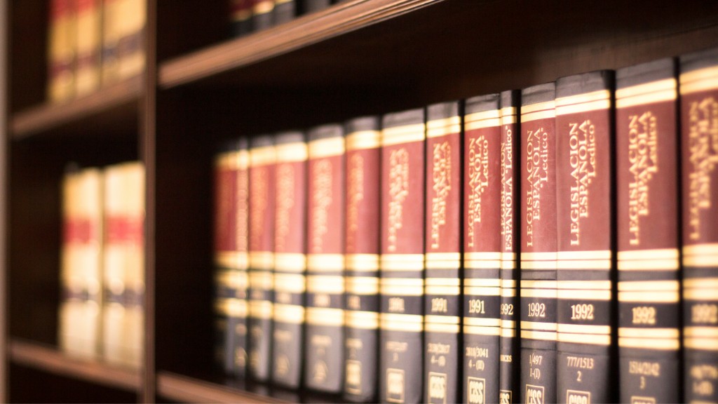 Leather-bound law books with gold detailing on a wooden shelf, stock image for fictional Calloway Solicitors
