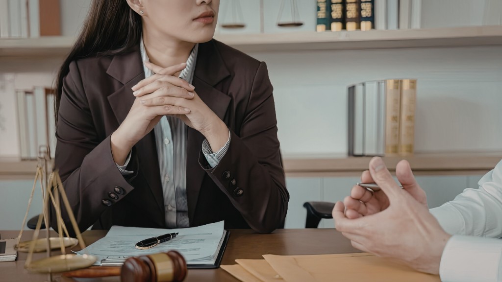 Solicitor meeting with a client across a desk at Calloway Solicitors, fictional family law firm