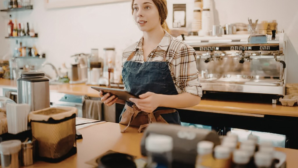 Barista taking an order behind the counter at Maison Bette, fictional Guildford café